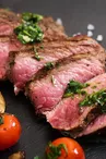 Juicy steak medium rare beef with spices and grilled vegetables.